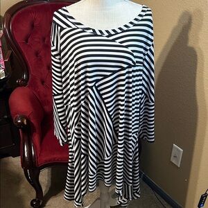 Woman Within Asymmetrical Black and White Striped Dress